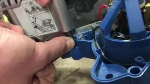 Replace the new belt cover in its place.