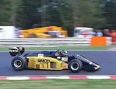Minardi raced variations on this original black-and-gold livery in the period 1985–1992. This is a Minardi M185 being raced at Brands Hatch in 2005.