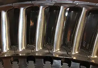 Turbine blades with sealing shroud at tip with knife edge fins which are part of the labyrinth sealing arrangement with open honeycomb shrouds on the turbine casing. The platforms at the base of the airfoil stops hot gas leakage which would overheat the turbine discs.