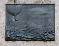 Plaque celebrating his enthusiasm for ballooning. (Bronze)