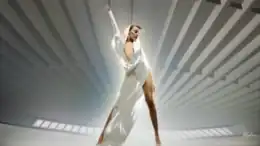 Minogue wearing a white hooded jumpsuit
