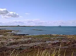 View towards Belhaven Bay (John Muir Country Park) with North Berwick Law and Bass Rock in the distance
