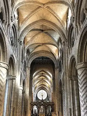 the interior looking east, with large, round decorated columns