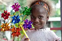 A child with pinwheels
