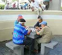 Image 19Four men playing dominoes in San Juan, Puerto Rico (from Culture of Puerto Rico)