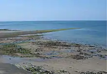Sarn Gynfelyn revealed by low tide