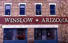 John Pugh's Slowin' Down to Take a Look mural, a tribute to the band the Eagles and the centerpiece of Standin' on the Corner Park in Winslow, AZ.