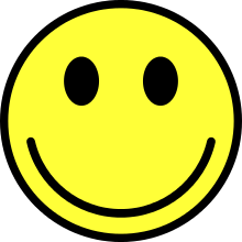 Graphic of a classic smiling face ideogram, yellow, with black borders against a white background
