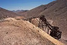 A trestle and ore bin at the Eagleville Mine, Mineral County, Nevada. Mount Annie and Mount Anna are in the distance.