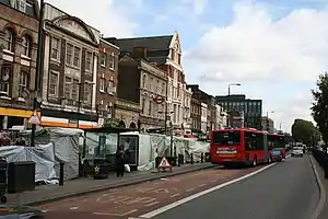Looking east on Whitechapel Road, near Whitechapel tube station and street market.
